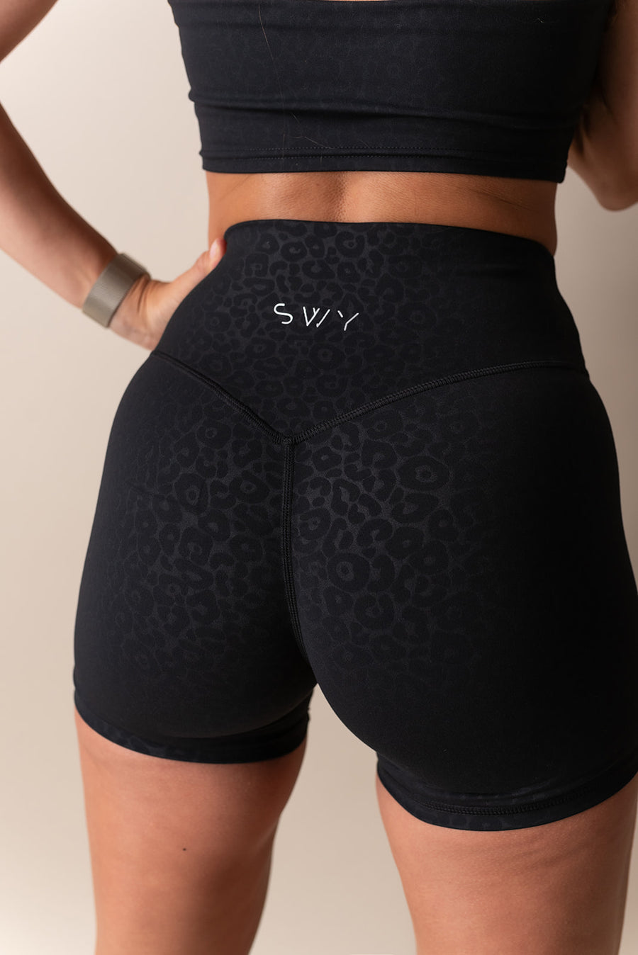 Swy black training short with leopard motive with hidden pocket in soft and stretchy material 