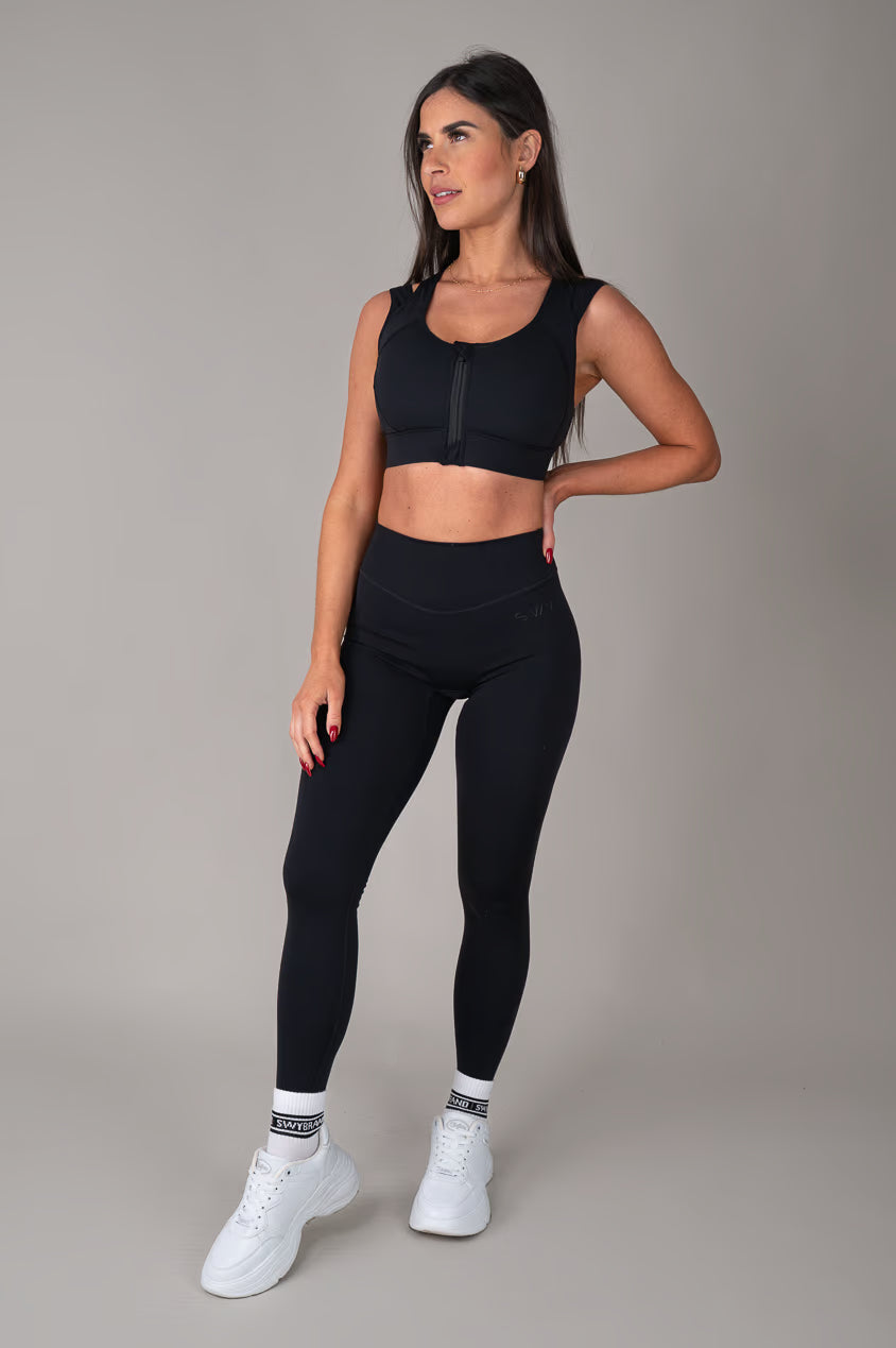 Black high support sports bra on model outfit
