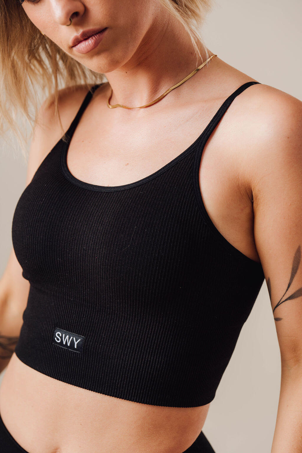 Swy's Serenity Cross Top in black color removable pads which provides a medium breast support 